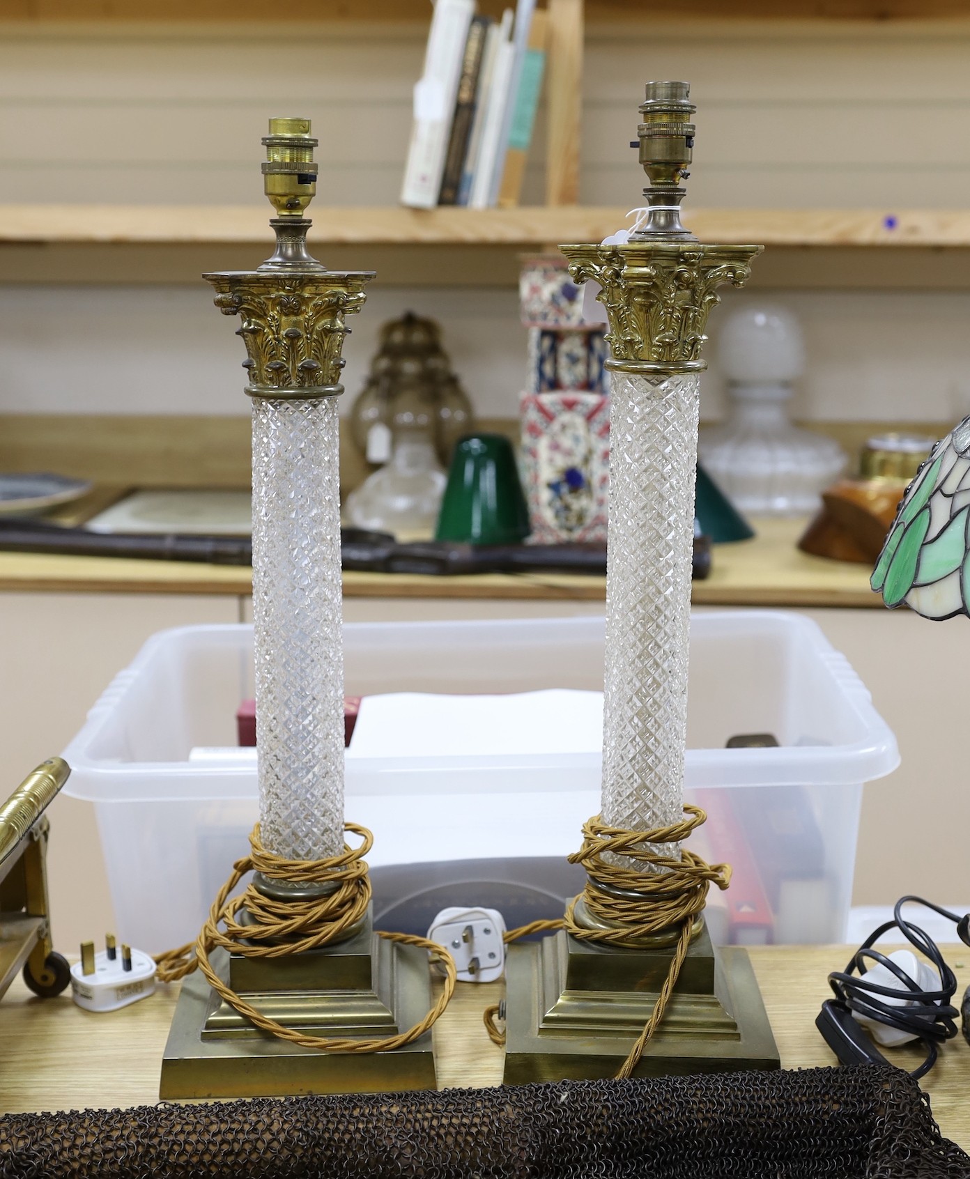 A pair of brass and glass Corinthian column table lamps, 57cm total height